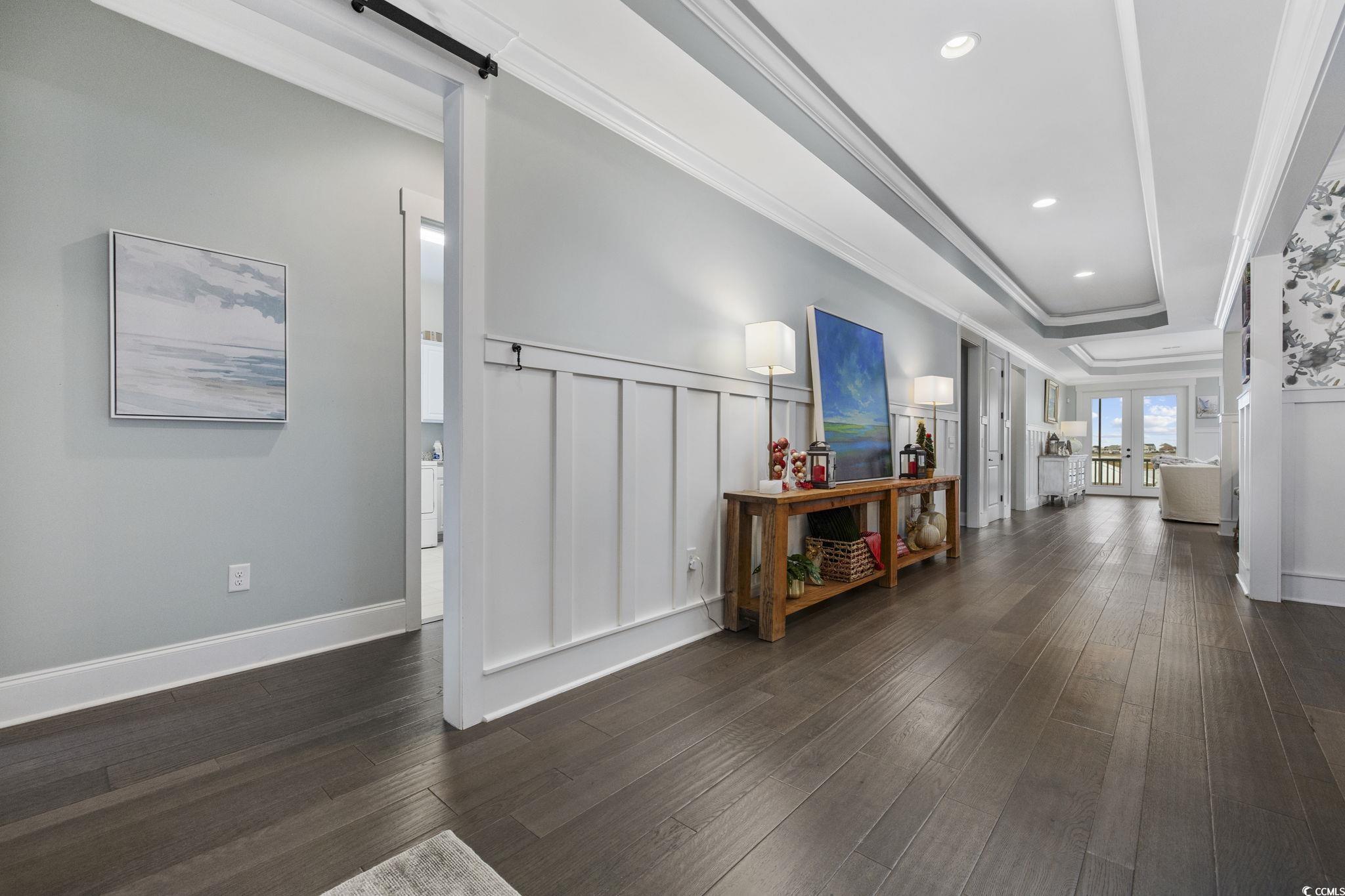 636 North Creekside Drive Murrells Inlet, SC 29576 - Photo 5 of 40 Corridor featuring ornamental molding, french doors, dark wood-style floors, recessed lighting, and a tray ceiling