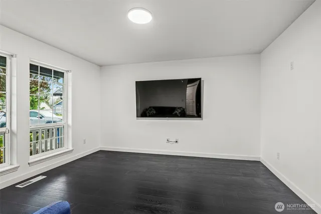a view of a livingroom with furniture and wooden floor