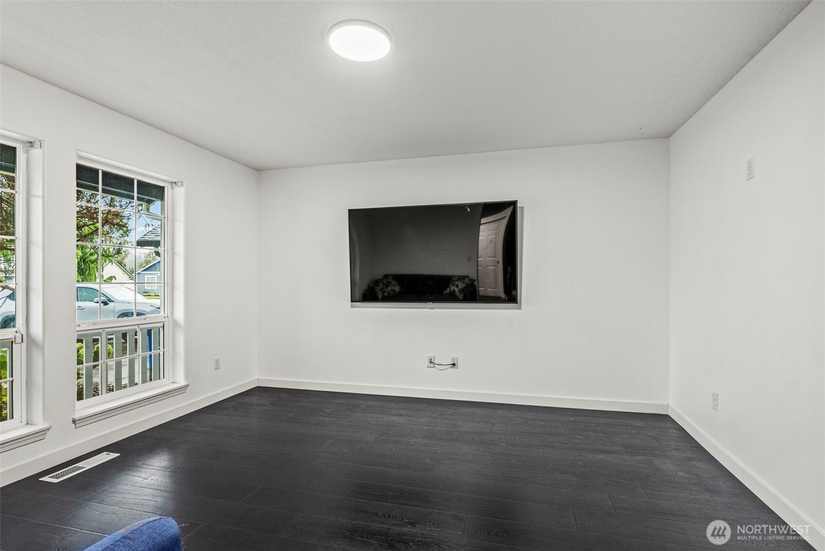 70 Crown Point Road Longview, WA 98632 - Photo 13 of 33 a view of an empty room with wooden floor and a window