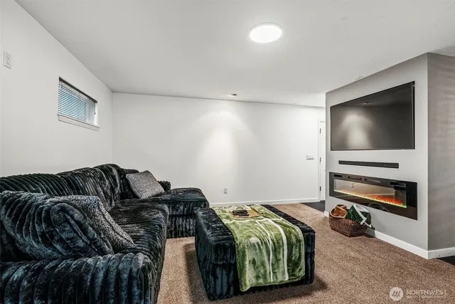 a bedroom with furniture and a window