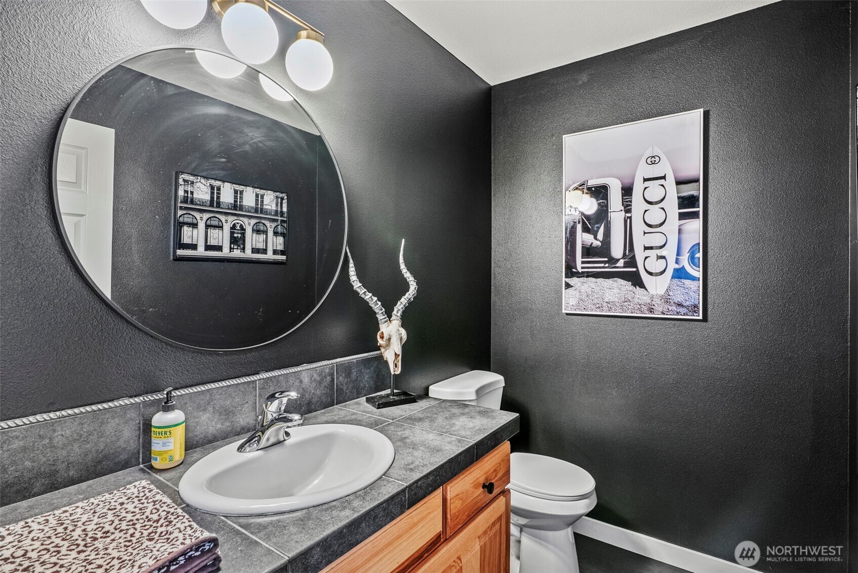 70 Crown Point Road Longview, WA 98632 - Photo 19 of 33 a bathroom with a granite countertop toilet a sink and mirror