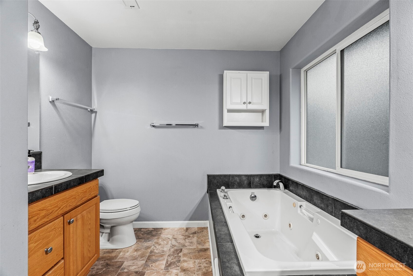 70 Crown Point Road Longview, WA 98632 - Photo 22 of 33 a white toilet sitting next to a bathroom sink