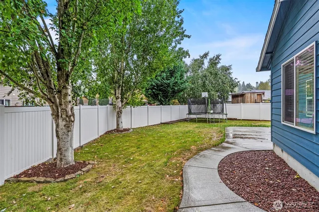 a view of a backyard with a small cabin