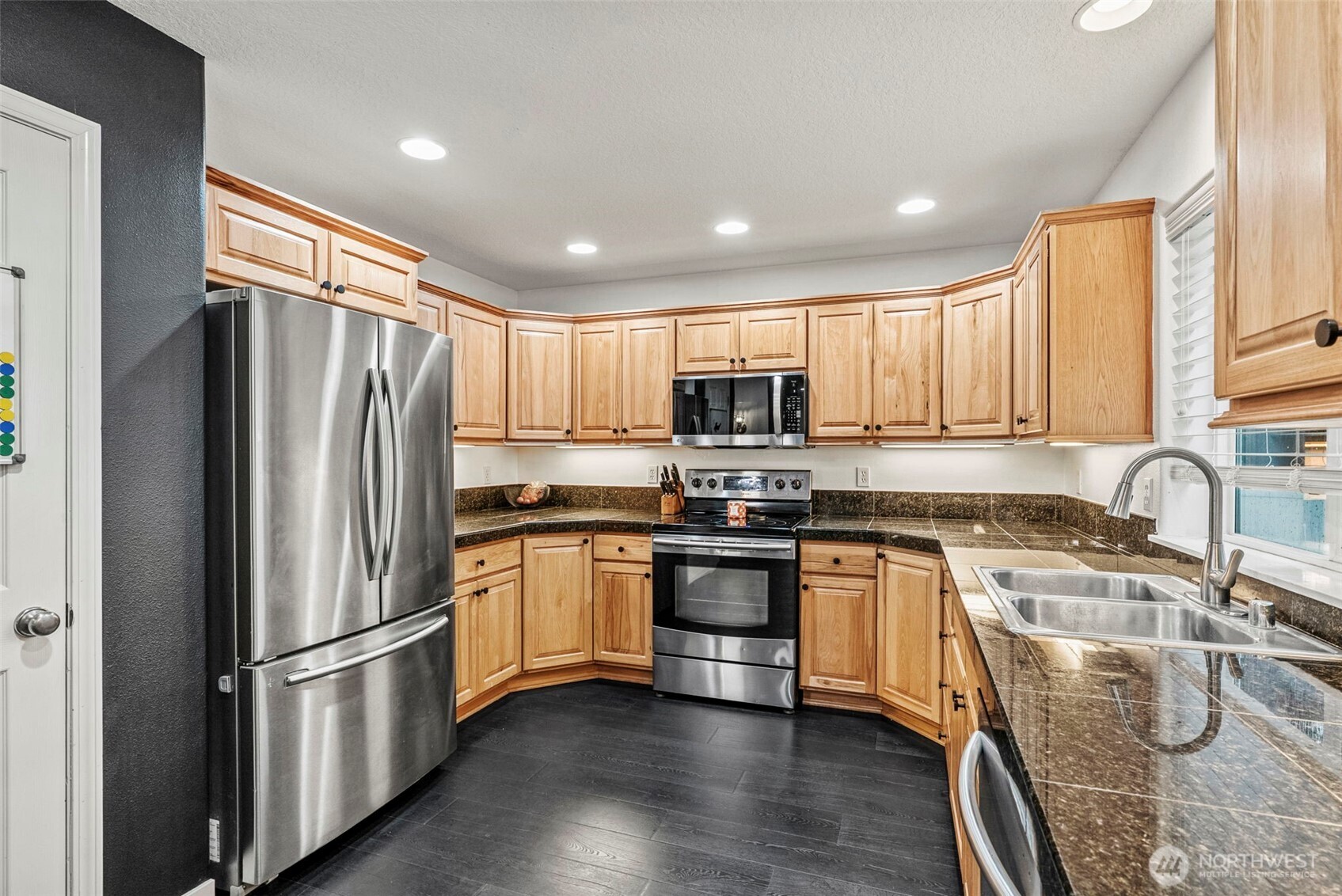 70 Crown Point Road Longview, WA 98632 - Photo 6 of 33 a kitchen with stainless steel appliances granite countertop a refrigerator stove microwave and sink
