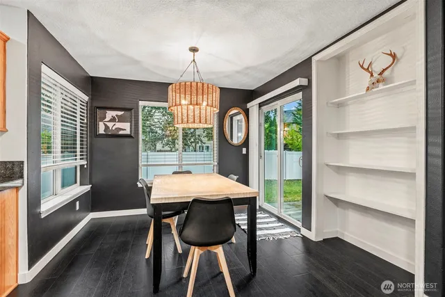a view of a dining room with furniture window and wooden floor