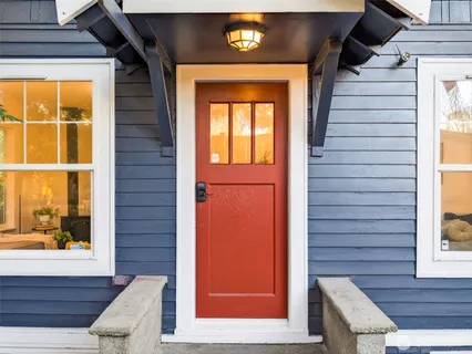 a view of front door of house with stairs