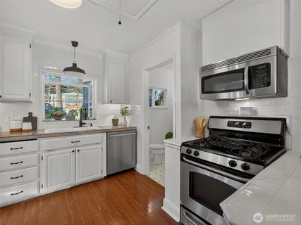 a kitchen with a stove and a microwave