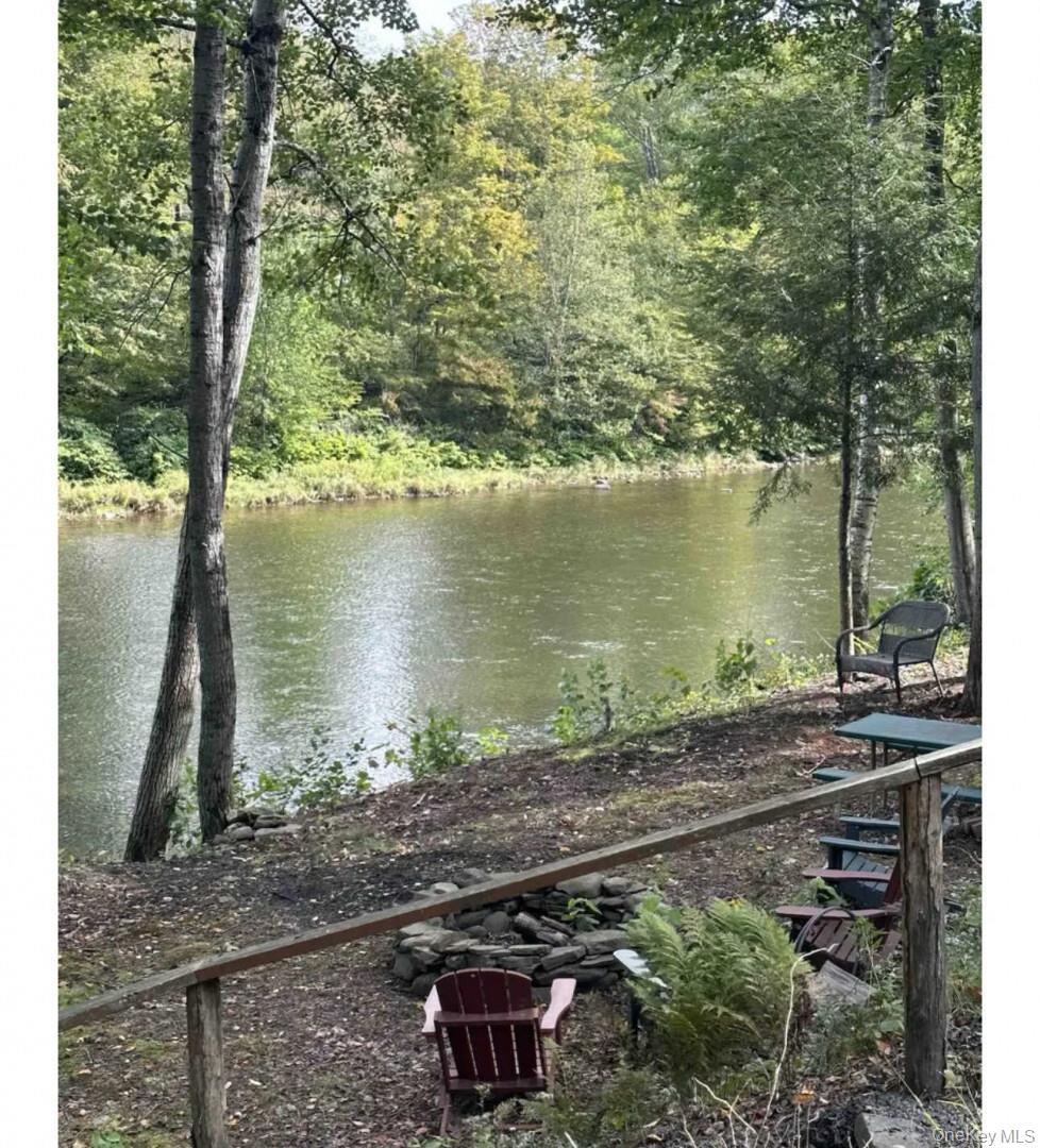 989 Chiloway Road Roscoe, NY 12776 - Photo 13 of 23 a view of a lake with a mountain and trees