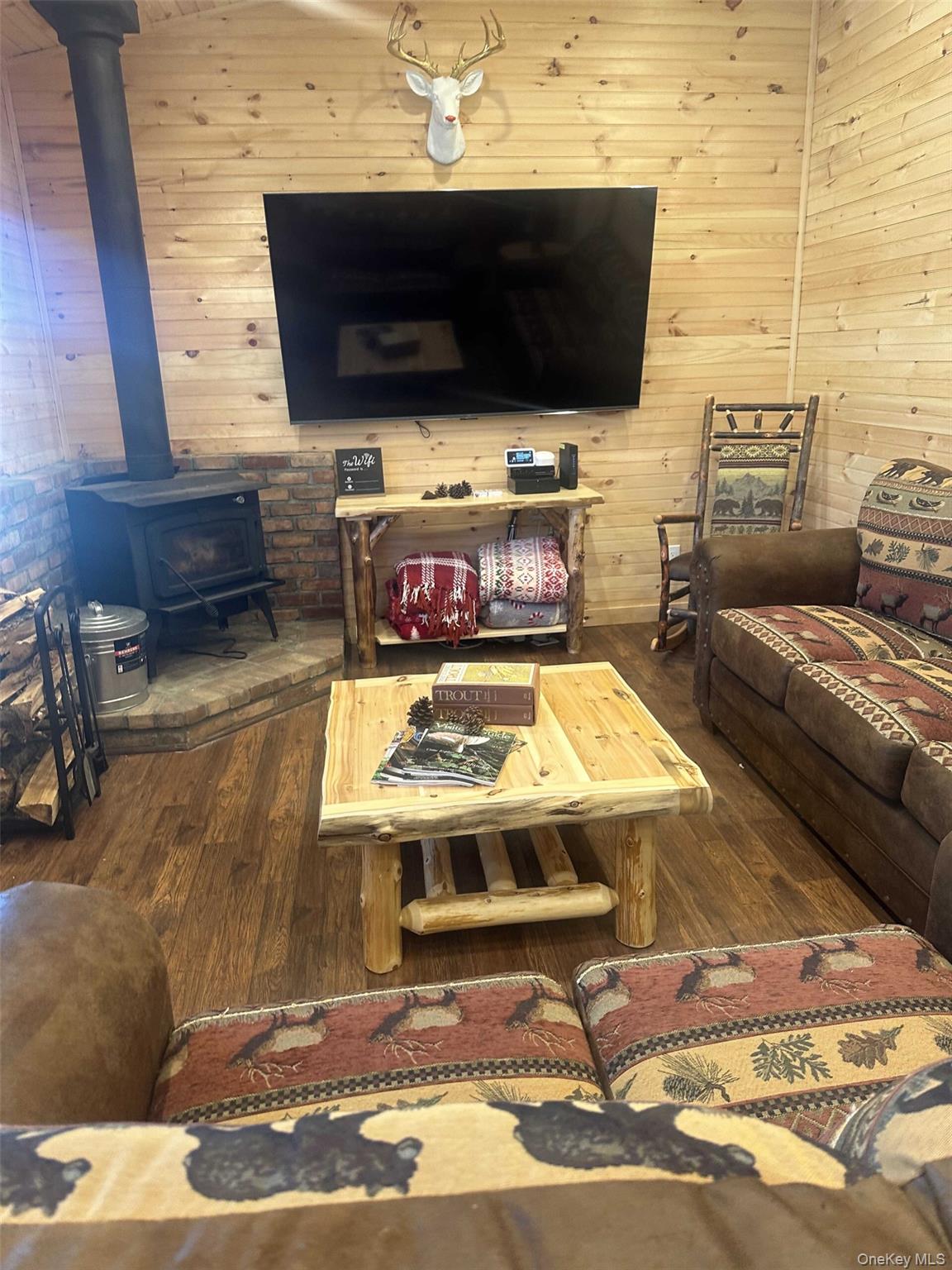 989 Chiloway Road Roscoe, NY 12776 - Photo 2 of 23 a living room with furniture and a flat screen tv
