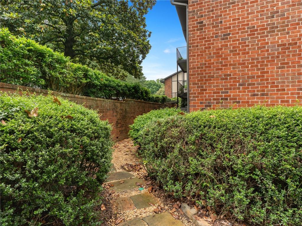 6851 Roswell Road, Unit H26 Atlanta, GA 30328 - Photo 34 of 49 a view of a pathway both side of house
