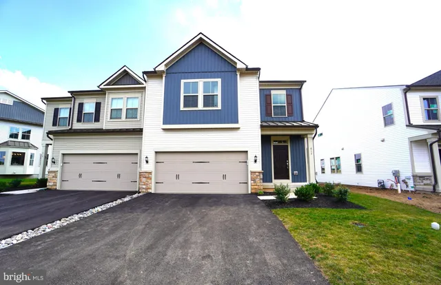 a view of a yard in front view of a house