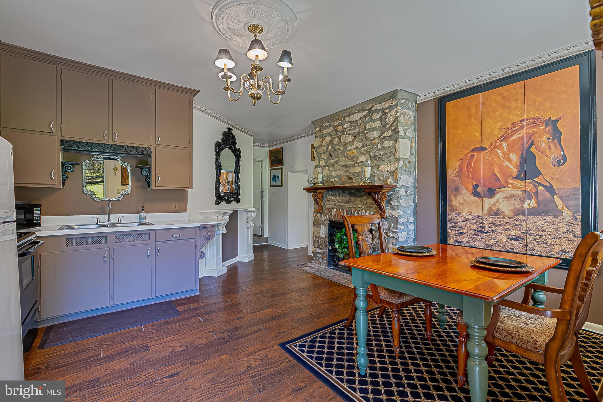 1610 Delaplane Grade Road Upperville, VA 20184 - Photo 26 of 123 a dining room with wooden floor and chandelier