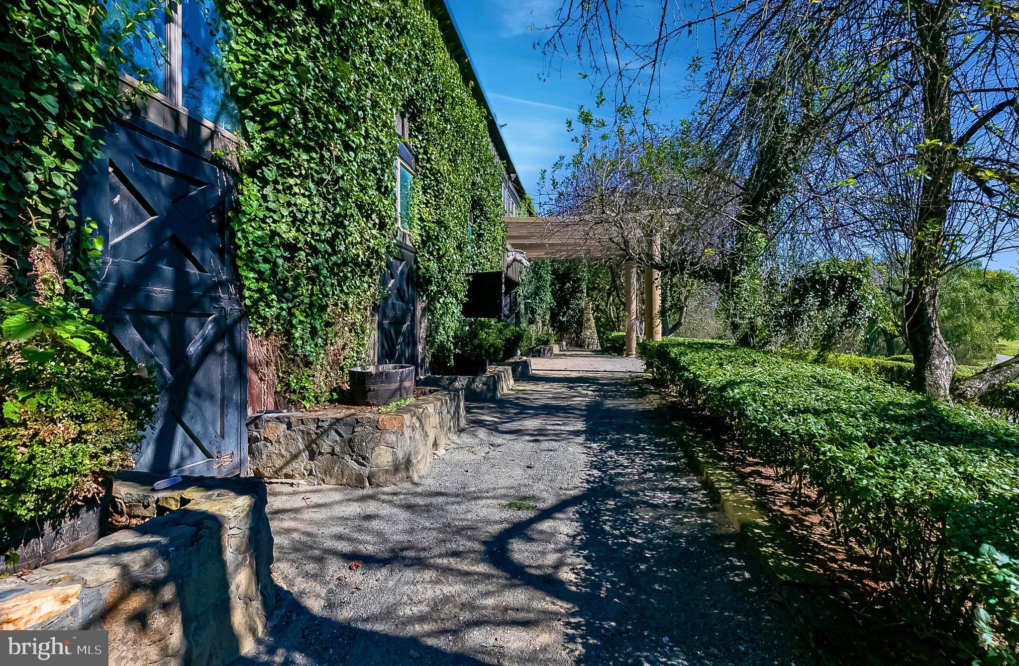 1610 Delaplane Grade Road Upperville, VA 20184 - Photo 42 of 123 a view of backyard with table and chairs and potted plants