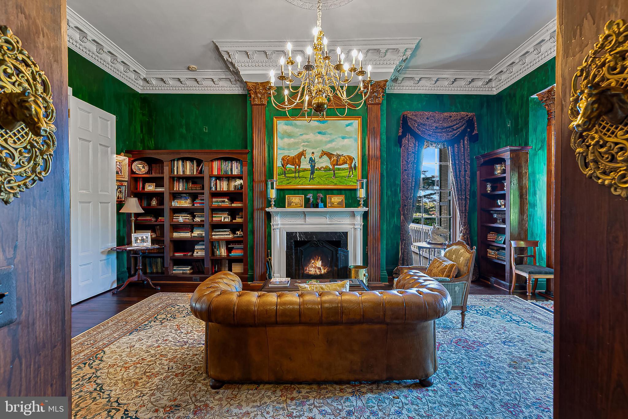 1610 Delaplane Grade Road Upperville, VA 20184 - Photo 64 of 123 a living room with furniture a fireplace and a chandelier