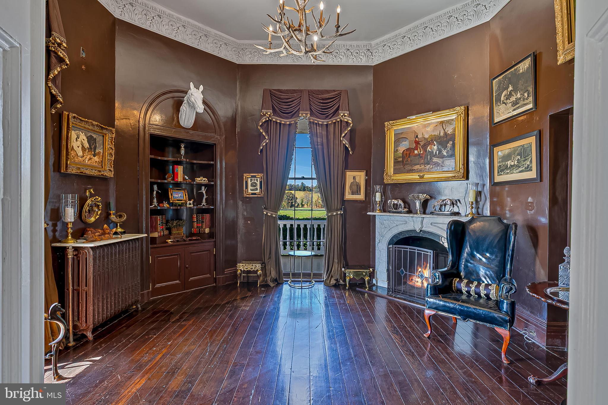 1610 Delaplane Grade Road Upperville, VA 20184 - Photo 71 of 123 a living room with furniture a fireplace and a flat screen tv