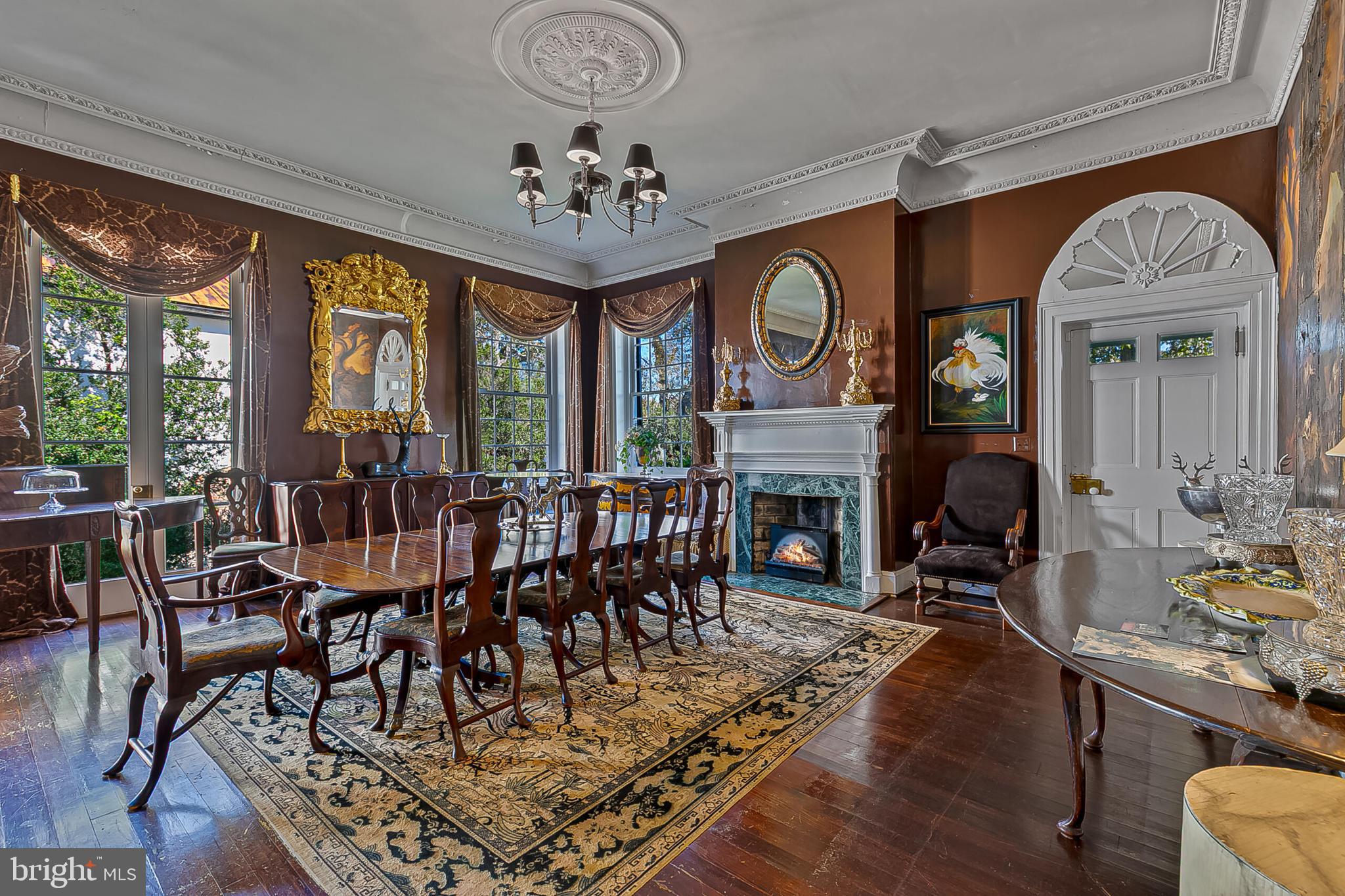 1610 Delaplane Grade Road Upperville, VA 20184 - Photo 80 of 123 a view of a dining room with furniture window and wooden floor
