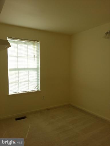 6174 Silver Arrows Way Columbia, MD 21045 - Photo 15 of 25 an empty room with a window