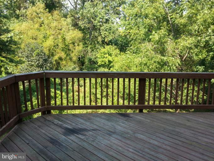 6174 Silver Arrows Way Columbia, MD 21045 - Photo 17 of 25 a view of wooden balcony with a wooden floor