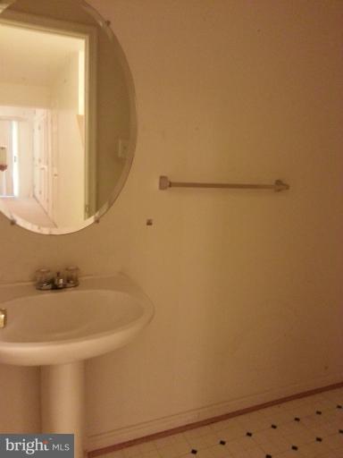 6174 Silver Arrows Way Columbia, MD 21045 - Photo 24 of 25 a bathroom with a sink and a mirror