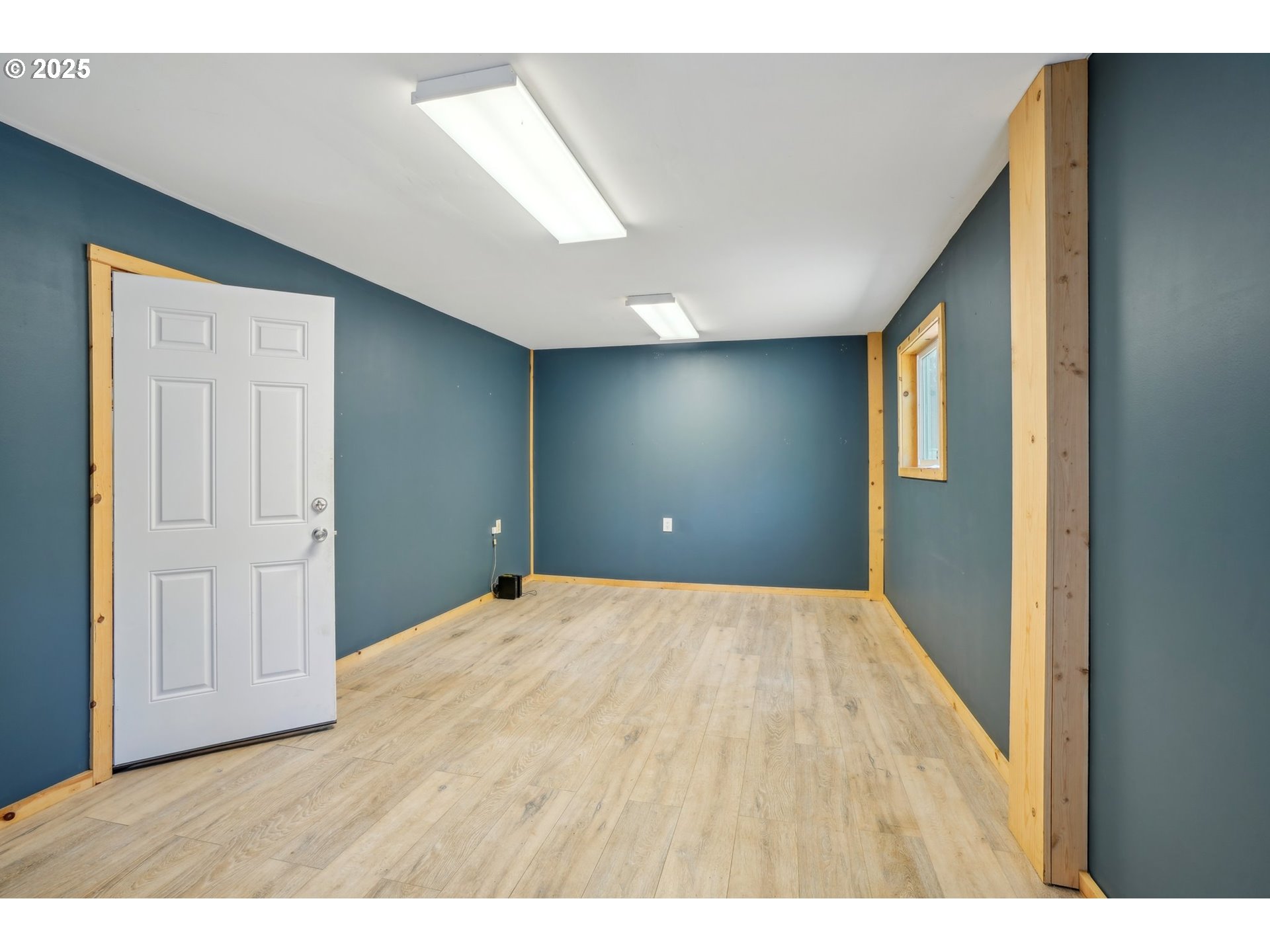 19933 East Victory Lane Sandy, OR 97055 - Photo 15 of 21 a view of an empty room with wooden floor