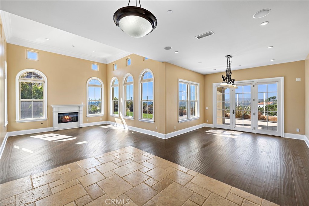 18 Via Cima San Clemente, CA 92672 - Photo 5 of 47 Entrance with Panoramic Ocean View. NOTE...The fireplace is functional but the fire is AI generated.