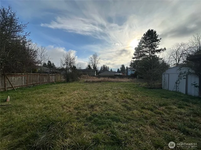 a backyard of a house with lots of green space