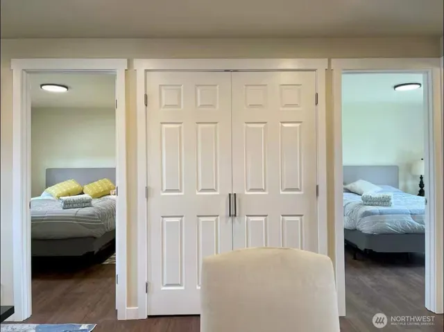 a bedroom with a bed and a chair