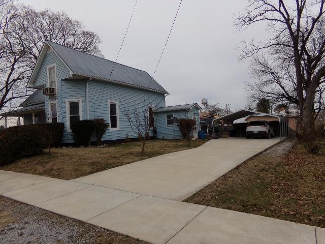 201 Spring Street Decherd, TN 37324 - Photo 2 of 26 Concrete drive & carport