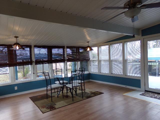 201 Spring Street Decherd, TN 37324 - Photo 20 of 26 Another of sunroom-watch the birds or kids in the fenced backyard