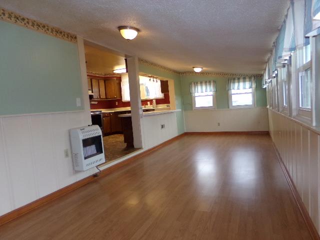 201 Spring Street Decherd, TN 37324 - Photo 23 of 26 Dining area with bar thru to kitchen-good space for counter eating & large enough for a sitting area