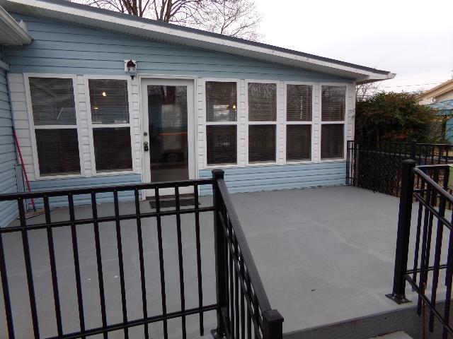 201 Spring Street Decherd, TN 37324 - Photo 8 of 26 Patio-from sunroom to carport