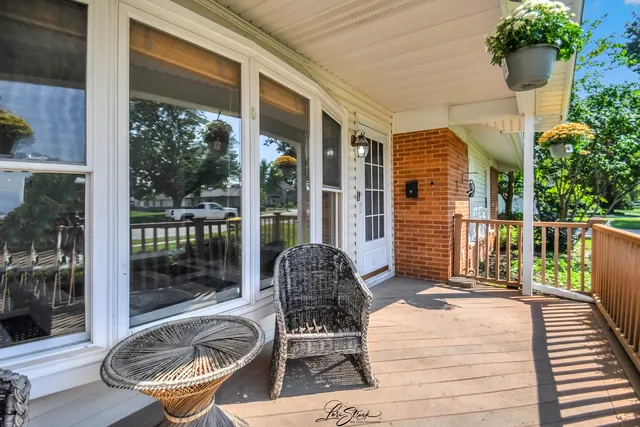 a house view with a seating space and garden