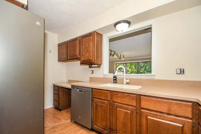 a kitchen with a sink and cabinets