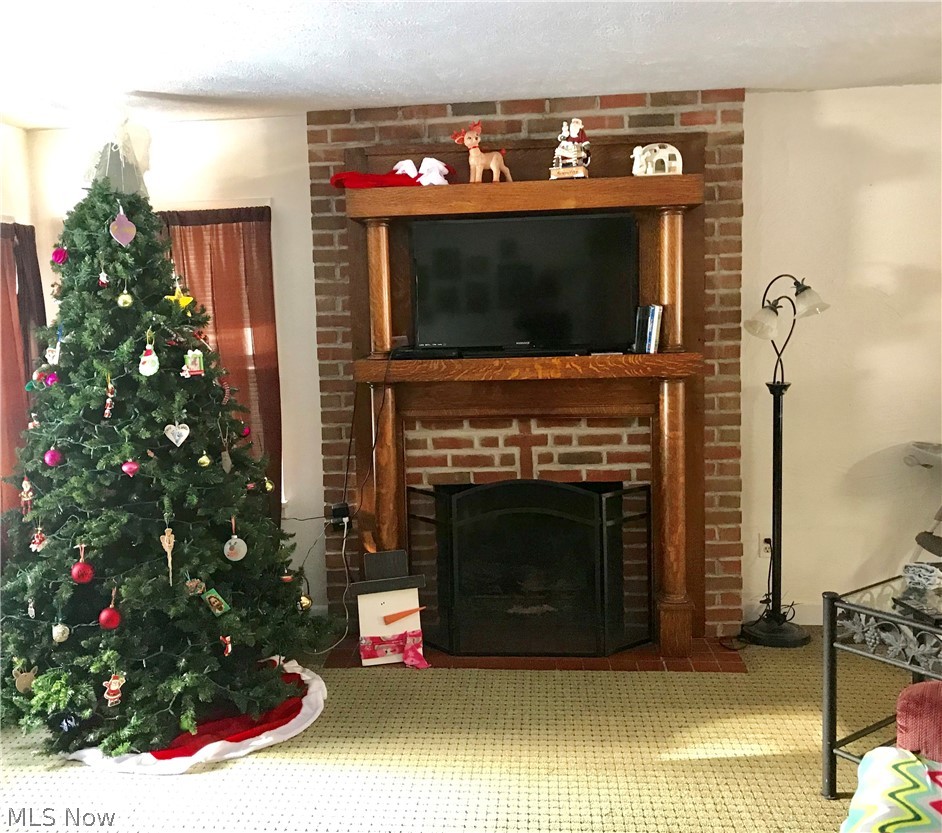 3175 Shellhart Road Norton, OH 44203 - Photo 8 of 13 Living room with beautiful fireplace and mantle.