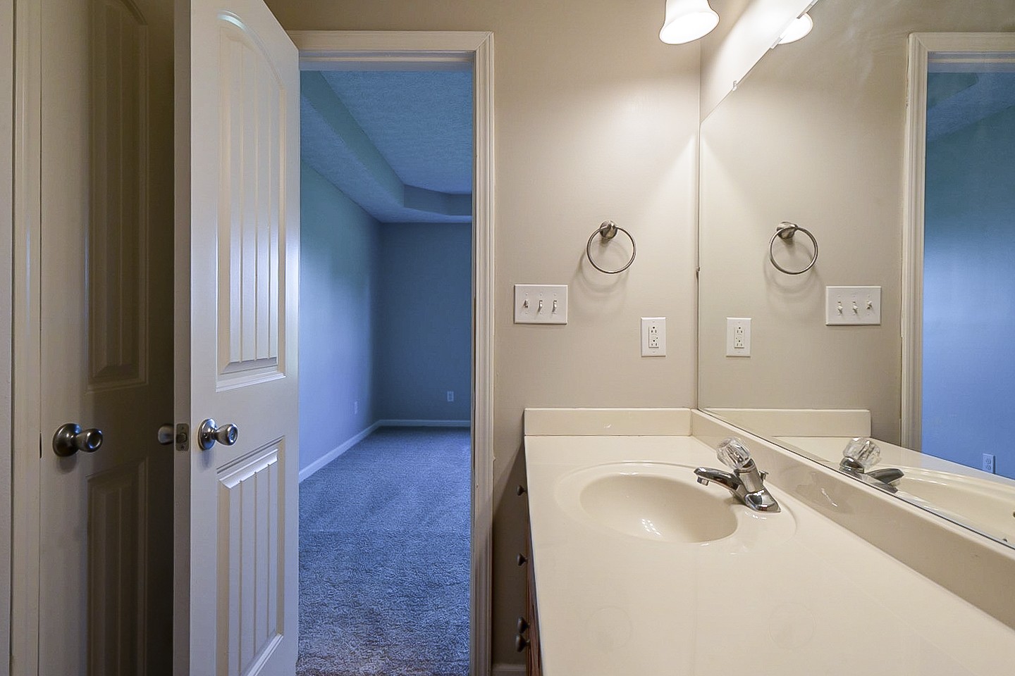 1505 Rapids Road Portland, TN 37148 - Photo 14 of 22 a bathroom with a sink and mirror