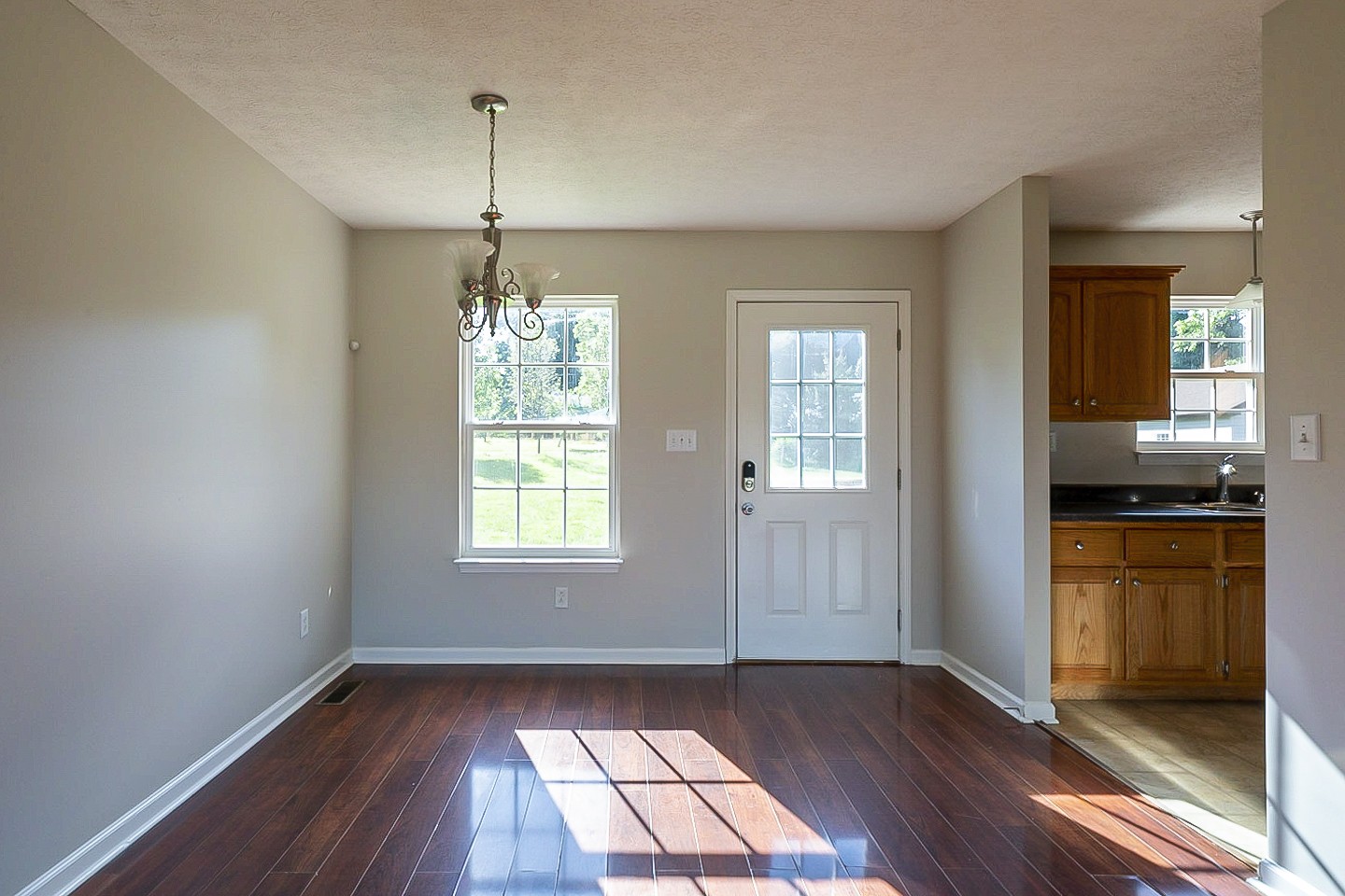 1505 Rapids Road Portland, TN 37148 - Photo 8 of 22 a view of an empty room with window and wooden floor
