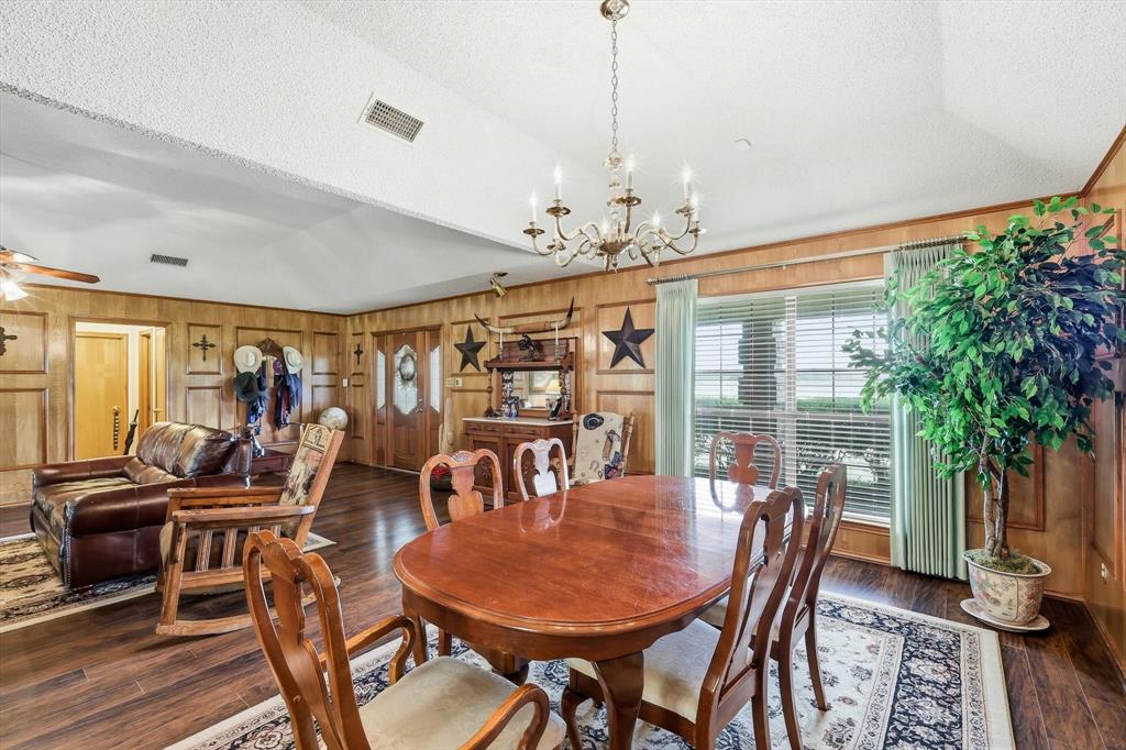 449 Private Road 4670 Rhome, TX 76078 - Photo 22 of 39 a view of a dining room with furniture window and wooden floor