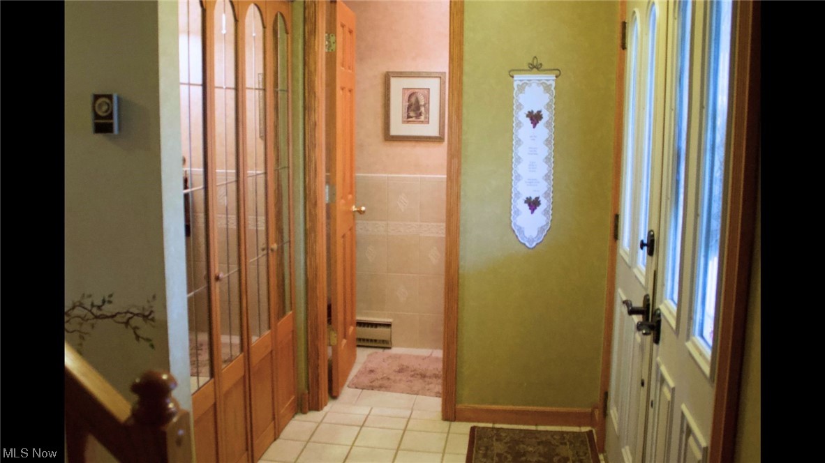 5406 McCartney Road Sandusky, OH 44870 - Photo 6 of 17 Bathroom featuring baseboard heating