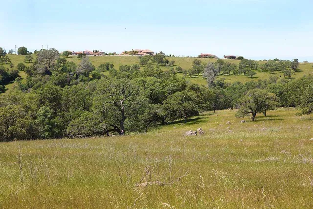 a view of a pool with a yard