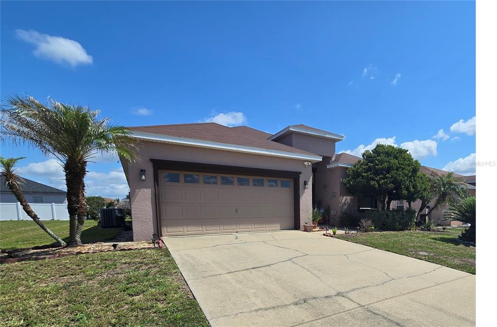 219 Cloverdale Road Winter Haven, FL 33884 - Photo 2 of 29 a front view of a house with a yard