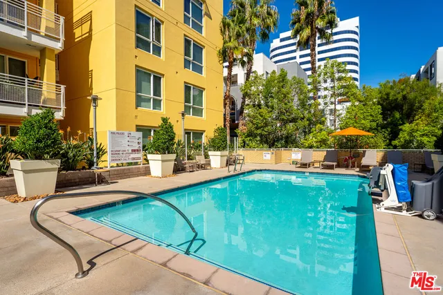 a view of swimming pool with outdoor seating