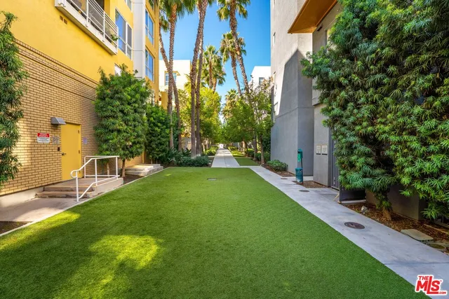 a view of backyard with swimming pool