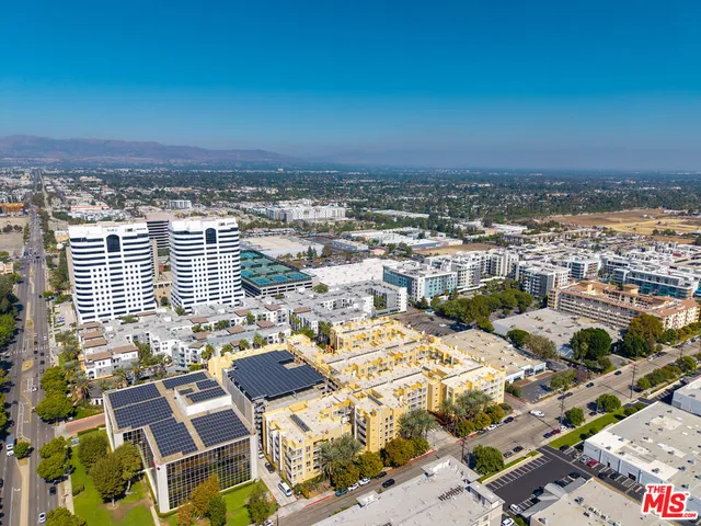 an aerial view of residential building and parking space
