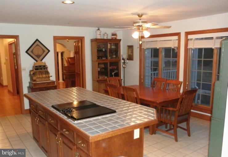 3995 Perry Hall Road Perry Hall, MD 21128 - Photo 11 of 26 a view of a dining room with furniture and wooden floor