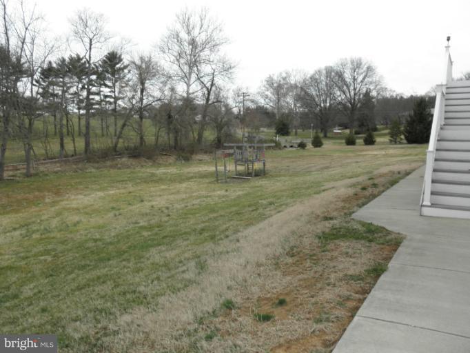 3995 Perry Hall Road Perry Hall, MD 21128 - Photo 12 of 26 a view of a yard with large trees