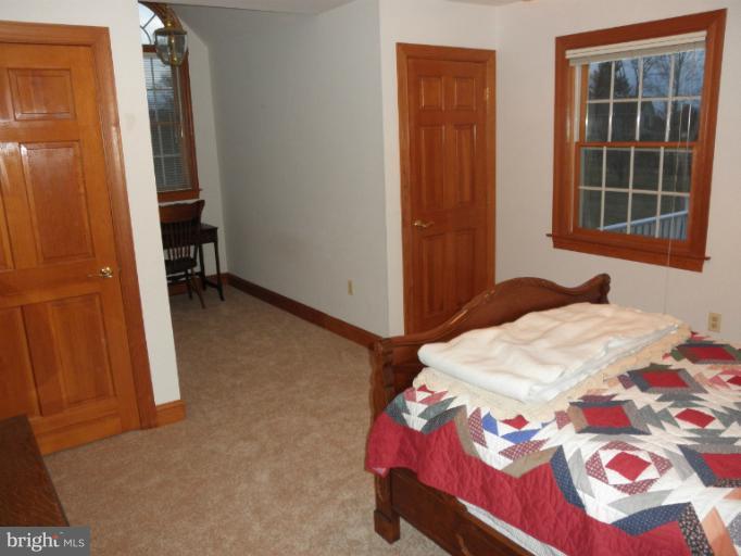3995 Perry Hall Road Perry Hall, MD 21128 - Photo 13 of 26 a bedroom with a bed and a window