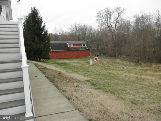 3995 Perry Hall Road Perry Hall, MD 21128 - Photo 3 of 26 a view of a yard with large trees