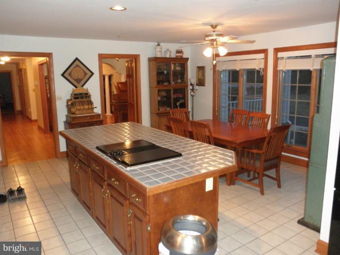 3995 Perry Hall Road Perry Hall, MD 21128 - Photo 21 of 26 a kitchen with stainless steel appliances granite countertop a stove a sink and a refrigerator