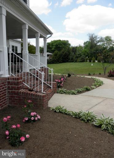 3995 Perry Hall Road Perry Hall, MD 21128 - Photo 23 of 26 a view of a house with a flower garden