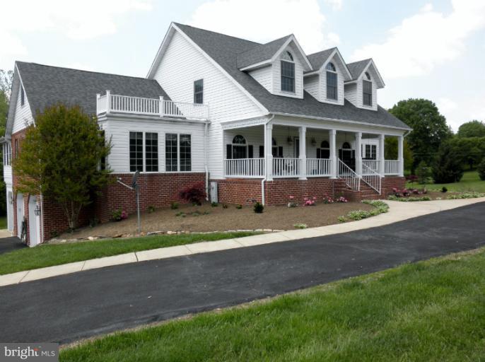 3995 Perry Hall Road Perry Hall, MD 21128 - Photo 24 of 26 a front view of a house with a yard and trees